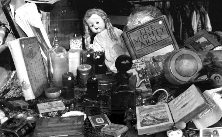 Black and white photograph. Antique shop window