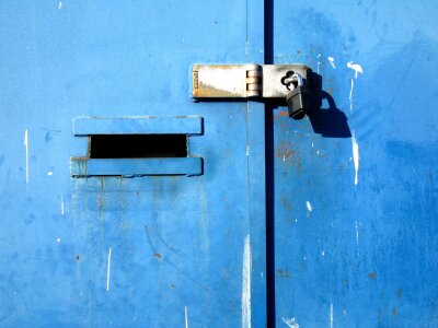 Blue iron door and padlock, London East End